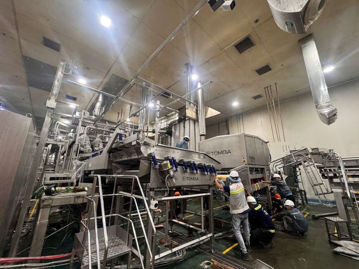 Technician assembling Tomra sorting machine